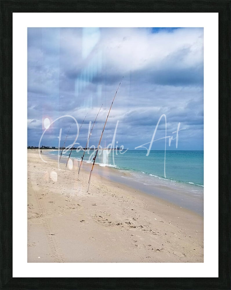 Black-framed shorefishing beach scene print featuring fishing rods on sandy shore under cloudy sky