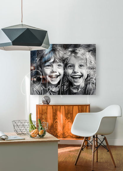 Black-and-white canvas print titled besties featuring two smiling children with curly hair hanging on a white wall