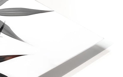 White rectangular tablet with sleek metallic edges showcasing black and white bamboo design on the front side