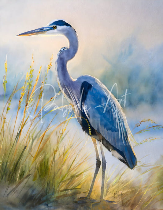 A watercolor painting of a blue-gray great blue heron standing in tall golden grass titled blue heron beachside