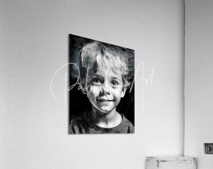 Black-and-white portrait print of a smiling child with tousled hair mounted on a wall in the product bobby