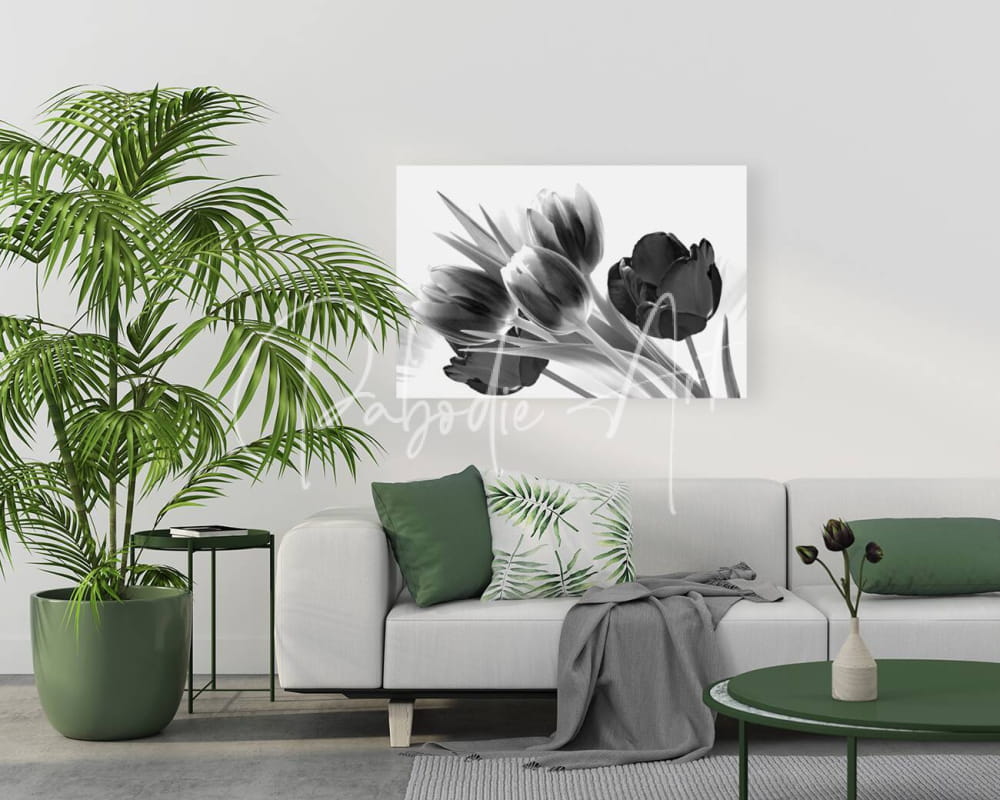Black and white canvas print of breezy blooming tulips hanging on the wall for elegant home decor