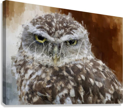 A canvas print of a burrowing owl portrait with detailed watercolor feathers and piercing yellow eyes