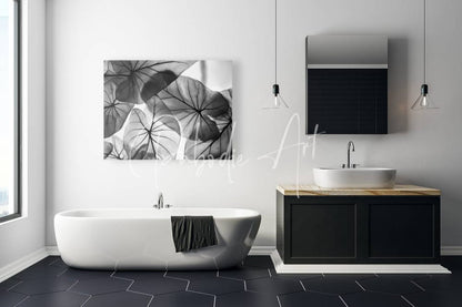 Black and white botanical canvas art featuring overlapping caladium leaf silhouettes for wall decor