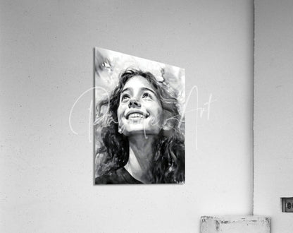 Black-and-white acrylic print titled Carefree of a smiling woman with curly hair mounted on a wall