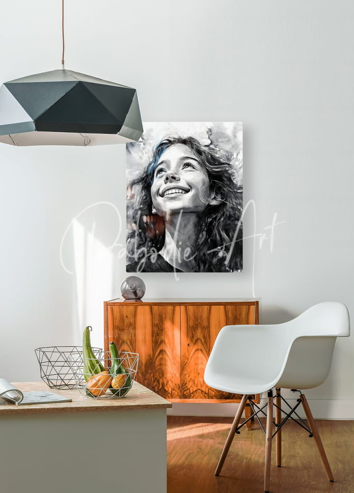 Black-and-white portrait canvas titled carefree featuring a smiling woman with curly hair mounted on a white wall