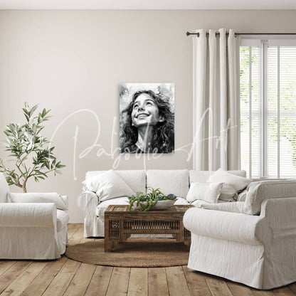 Black-and-white portrait canvas of a smiling woman with curly hair titled carefree mounted on the wall