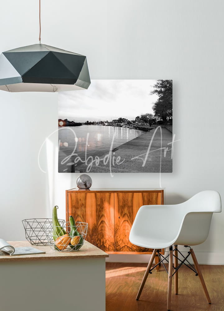 Black-and-white canvas print of a lakeside scene titled cloudy dawn hanging on a wall