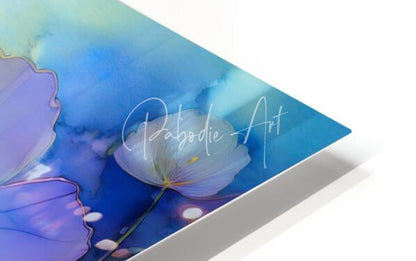 A vibrant watercolor print of blue and purple flowers on a glossy angled canvas signed by pabodie art titled dancing viola watercolor