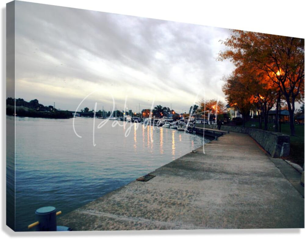 Canvas print of dawn on the huron river featuring an autumn waterfront scene with moored boats and cloudy sky