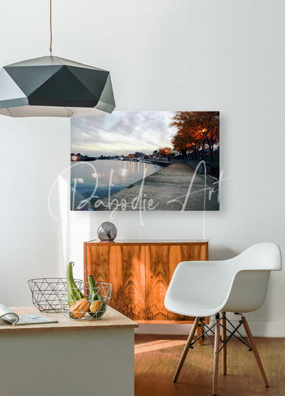 A rectangular canvas print of dawn on the huron river showing a serene autumn lakeside with twilight lighting mounted on a wall