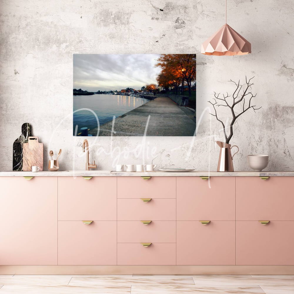 A rectangular canvas print titled Dawn On The Huron River showing a serene lakeside path with autumn trees