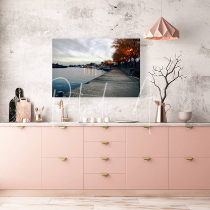A rectangular canvas print titled Dawn On The Huron River showing a serene lakeside path with autumn trees