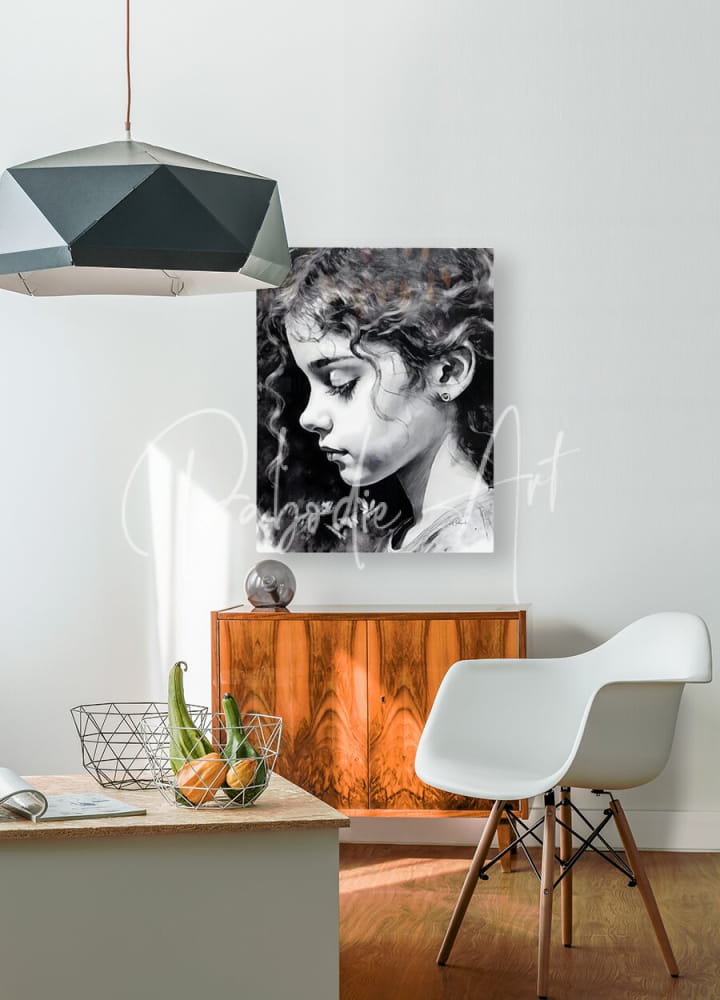 Black and white canvas portrait of a young girl with curly hair titled daydreaming hanging on the wall