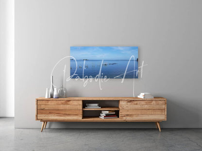 A serene blue ocean canvas print titled dock of better days perfect for calming home decor