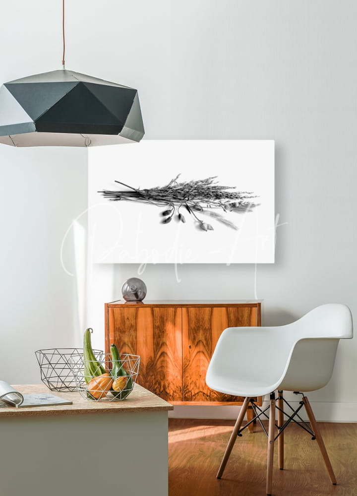 Black and white canvas print of dried grasses and flower pods featuring a bundle of wheat hanging on the wall