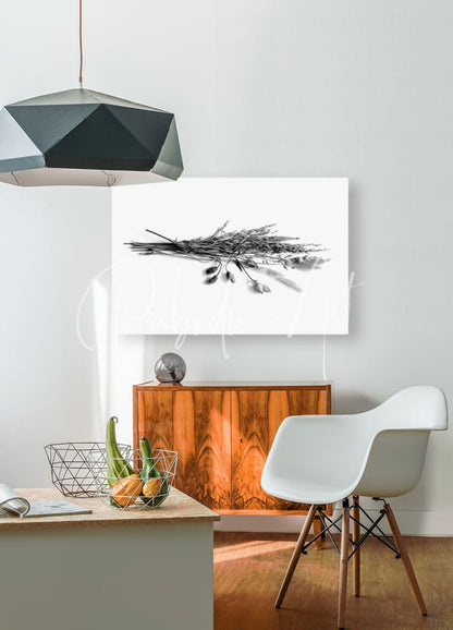 Black and white canvas print of dried grasses and flower pods featuring a bundle of wheat hanging on the wall
