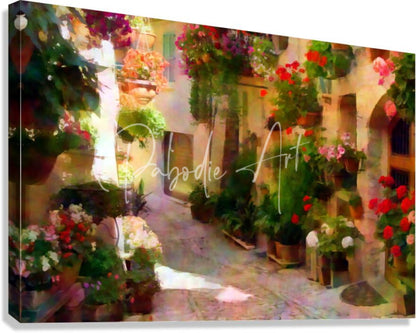 A vibrant canvas print titled flower filled cobblestone alley depicting a sunlit european alleyway with red purple and green flowers