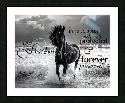 Black framed print featuring a dynamic black and white horse galloping through ocean waves titled Freedom Horse