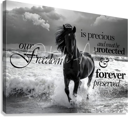 Black and white canvas print of a dynamic horse galloping through ocean waves titled freedom horse with elegant script text