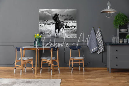Black and white canvas print of a galloping horse with inspirational text titled freedom horse for wall decor