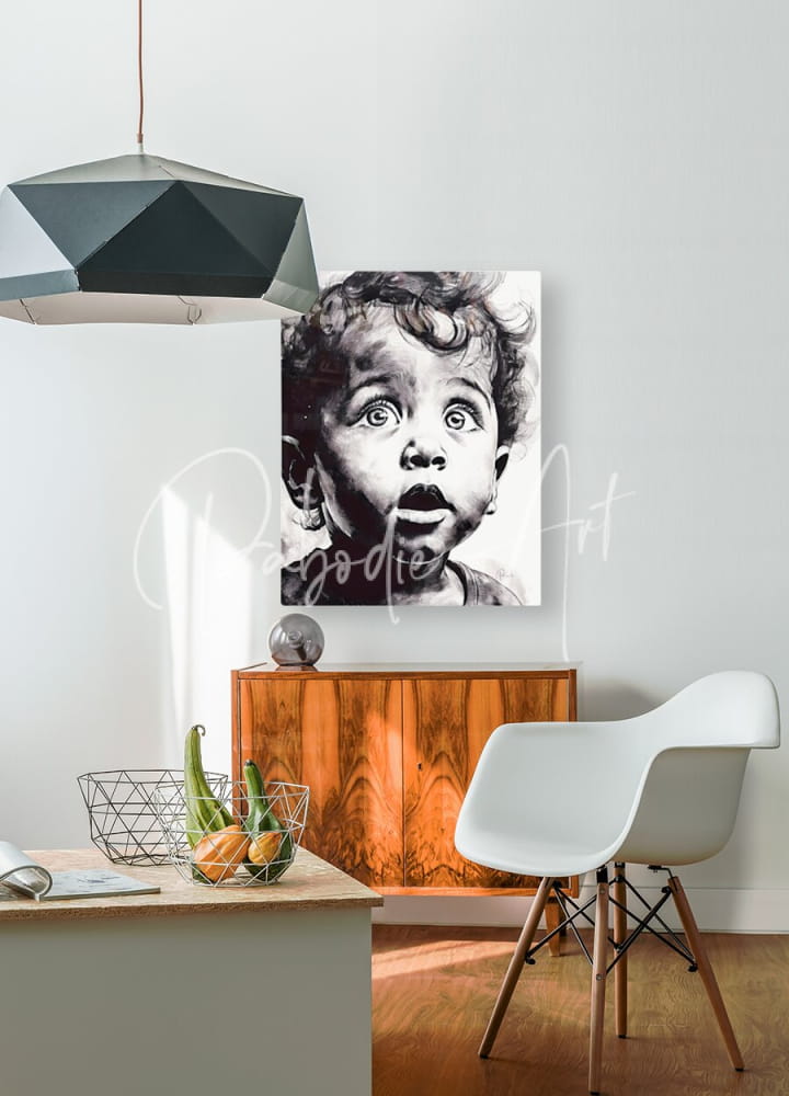 Black-and-white canvas print titled gazing in wonder of a child with curly hair and wide eyes mounted on a white wall