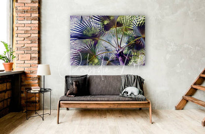 A vibrant abstract palm leaf canvas print in bold purple and green hues titled glorious palms hanging on wall