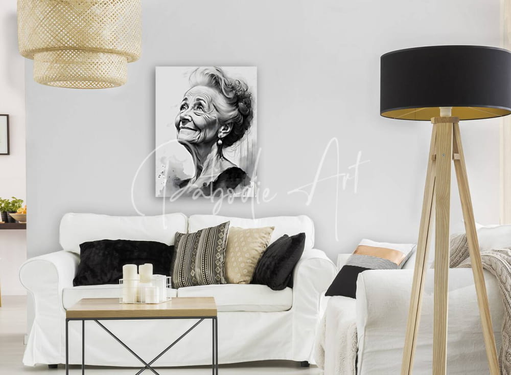 Black and white portrait canvas of a smiling elderly woman with styled hair and earrings mounted on a gray wall