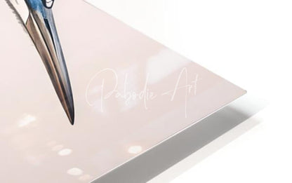 A sleek metallic silver pen with a pointed tip resting on a translucent pink acrylic surface for great blue heron ink wash
