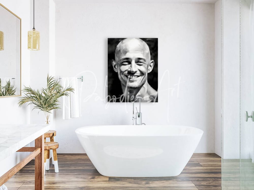 Black-and-white portrait canvas titled happiness featuring a smiling bald man with defined facial features on white wall