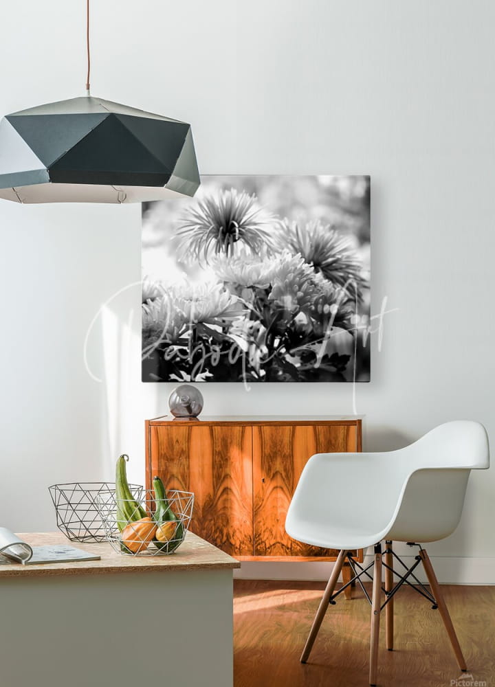 Black-and-white floral canvas art titled mums and more in black and white hanging on a wall for home decor