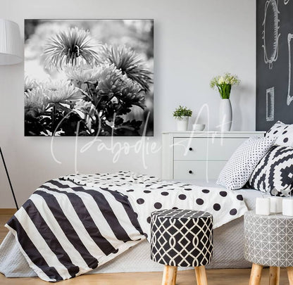 Black-and-white floral canvas print titled mums and more in black and white hanging on the wall