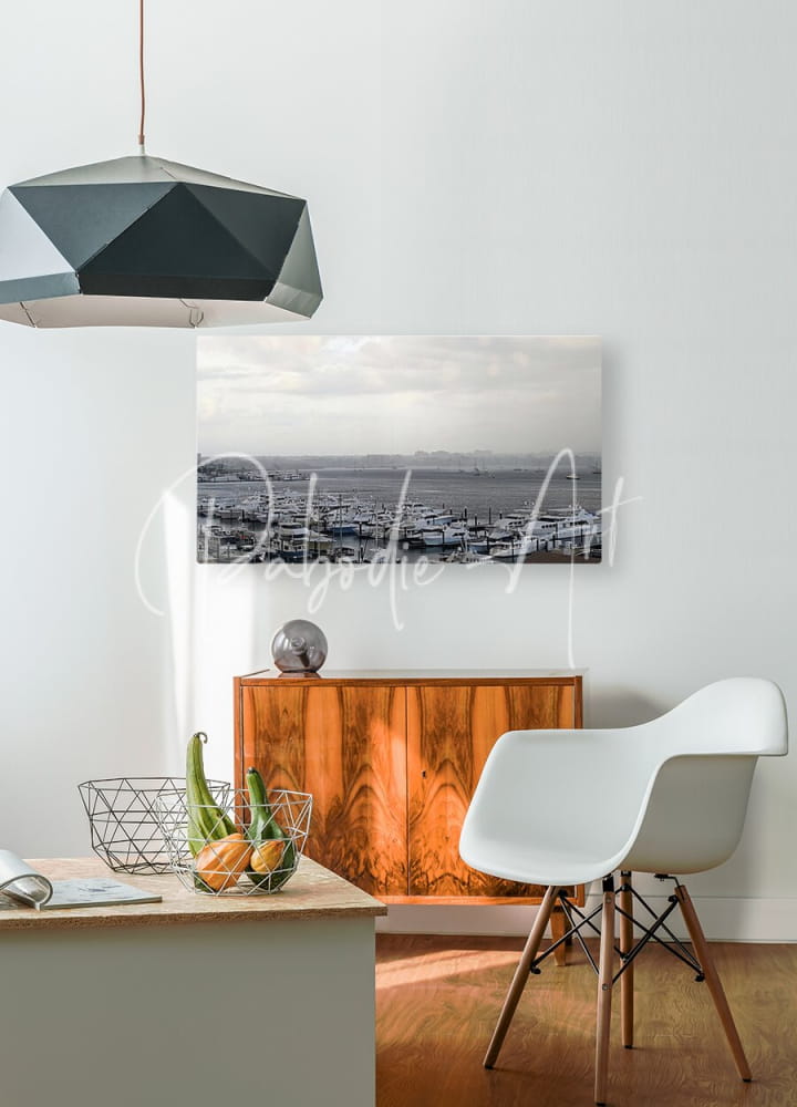 Black geometric pendant light with faceted angular design hanging from thin cord from old port cove marina collection