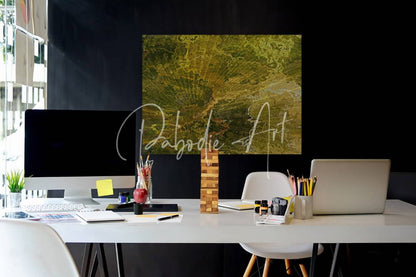 A rectangular canvas print titled palm burst rays II with an abstract textured design in green and gold tones hanging on a wall