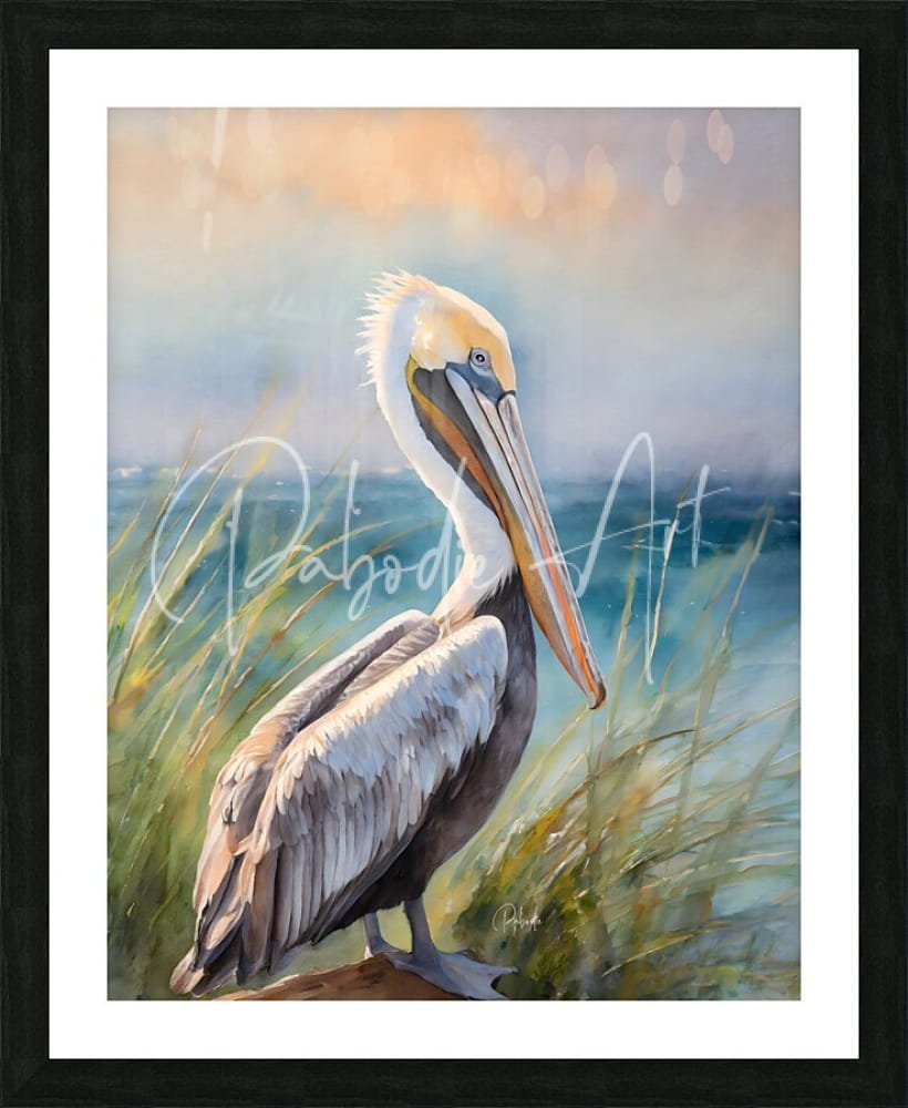 A framed watercolor painting titled Pelican Shores featuring a pelican with white and gray feathers standing in tall grass by the ocean