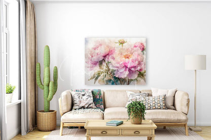 A soft pink peonies watercolor painting on paper hanging above a beige sofa in a living room setting