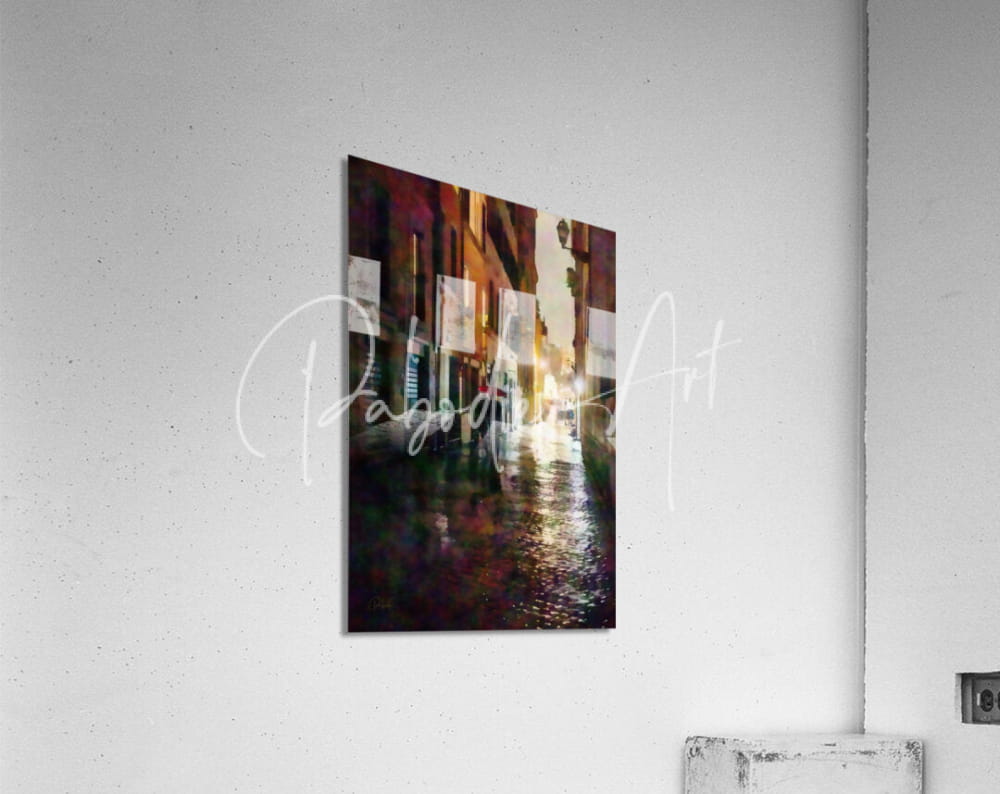 Abstract cityscape print on modern acrylic wall hanging with warm amber and burgundy tones reflecting on wet pavement