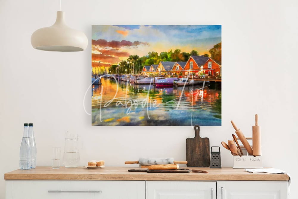 Vibrant watercolor painting titled River Living Sunset of a harbor at sunset with red-roofed buildings and boats reflected