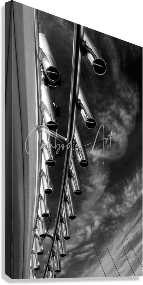 Black-and-white canvas print of modern abstract polished chrome tube sculpture titled rod holders against dramatic sky