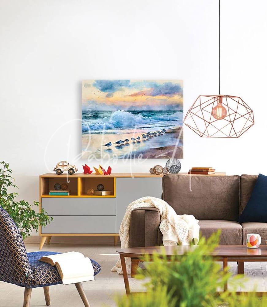 Watercolor beach scene canvas painting titled sanderlings along the shore with soft blues oranges and whites showing waves crashing