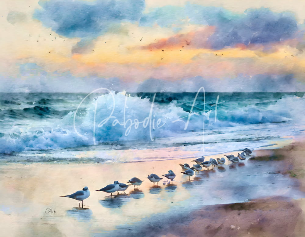 A watercolor painting titled sanderlings along the shore showing seagulls on wet sand at sunset with waves and colorful clouds