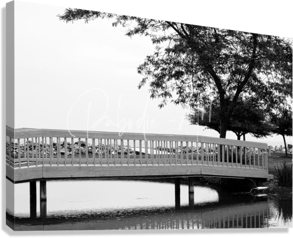 Black and white canvas print of sawmill creek wooden bridge featuring a wooden railing arching over water framed by trees