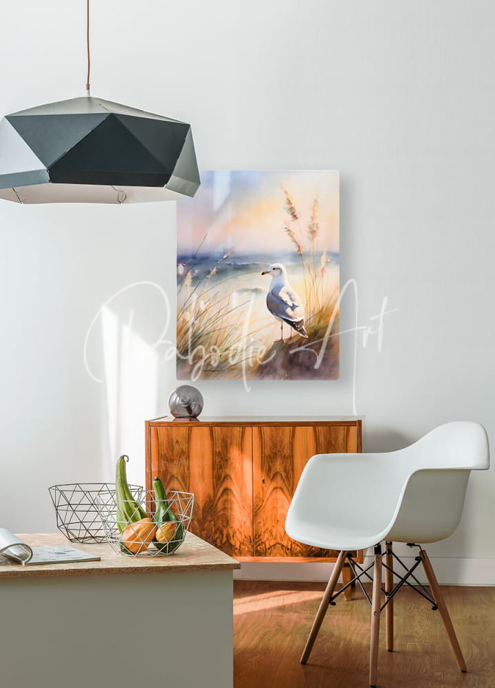 Watercolor painting titled seagull perch of a seagull standing on beach grass under a soft sunset sky framed white