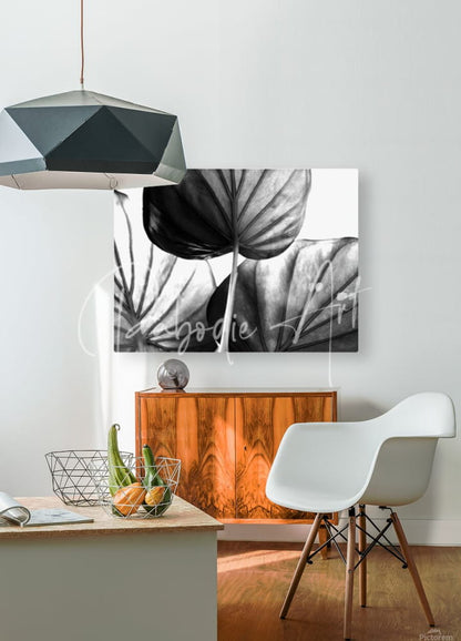 Black-and-white botanical canvas print featuring large detailed leaf silhouettes titled tree of life leaf art