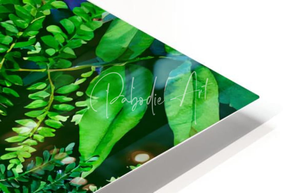 A vibrant green tropical leaves artwork printed on a sleek modern acrylic panel with pabodie art signature