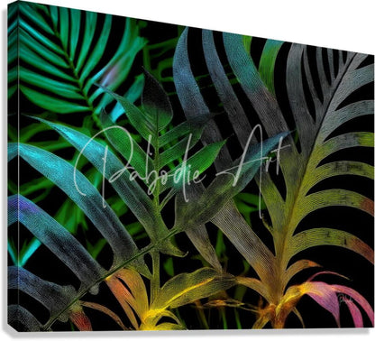 Vibrant tropical leaf canvas print with iridescent green teal yellow and pink hues on black background titled tropical leaves at night