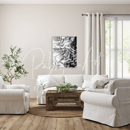 Black and white abstract leaf artwork titled tropical transparencies iv hanging on wall as modern wall decor