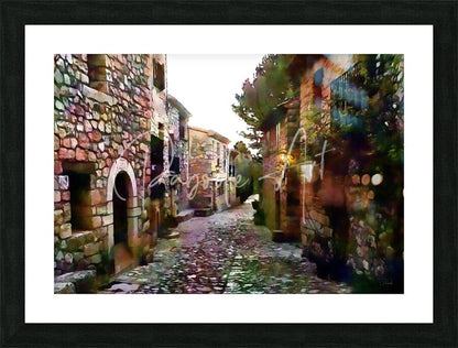 Black-framed art print of tuscany cobblestone streets and homes featuring rustic stone buildings and alleyway scene