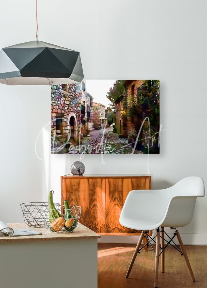 A rectangular canvas print of tuscany cobblestone streets and homes featuring colorful rustic stone buildings and greenery
