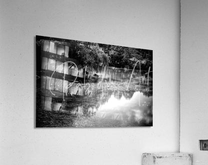 Black and white acrylic print of willow water reflections with reflective water and architectural silhouettes mounted on wall